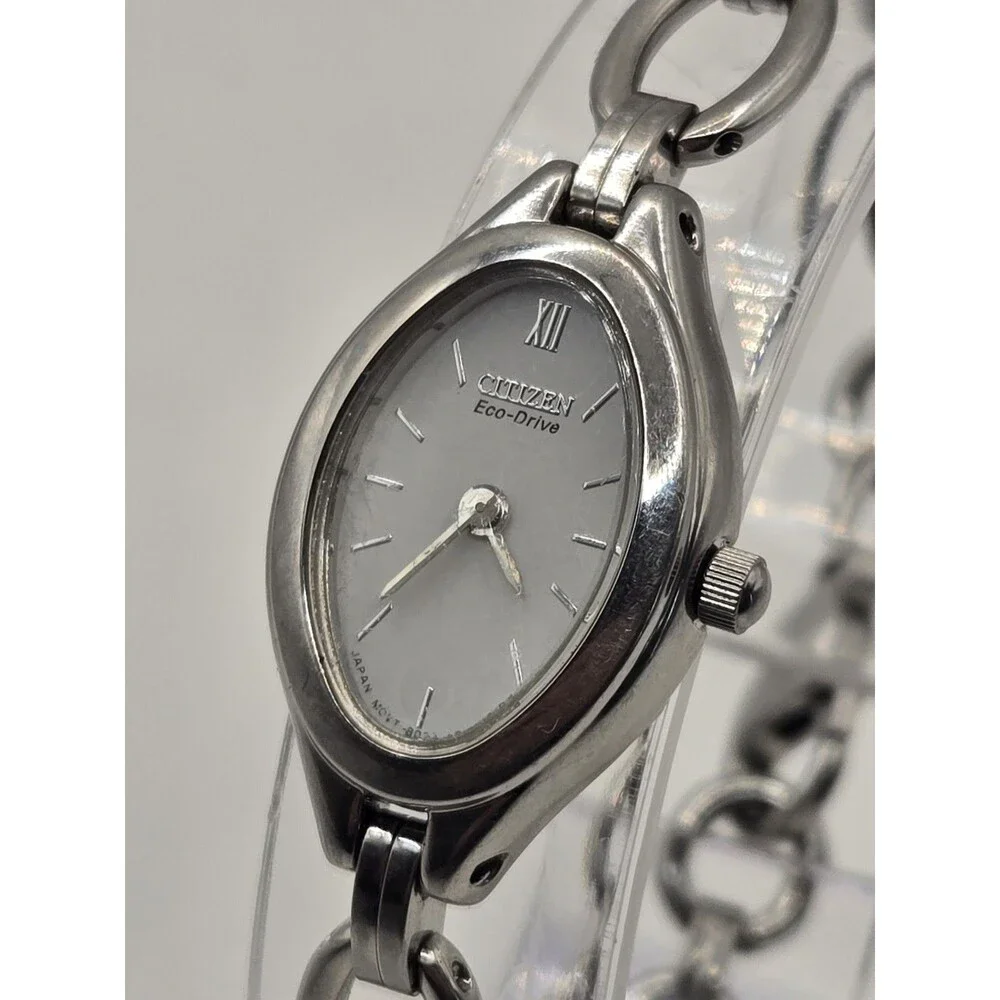 Citizen Eco-Drive Oval Silver Tone White Dial Heart Charm Bracelet Watch.